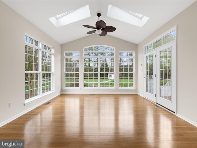 unfurnished sunroom with visible vents, french doors, and a skylight