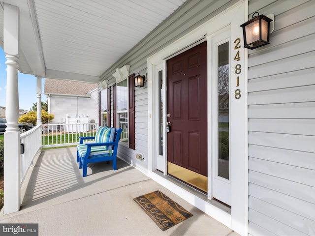 property entrance featuring covered porch