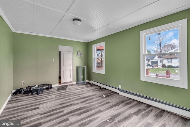 423 Main St, Dorchester, NJ 08316 - spare room featuring baseboards, wood finished floors, and a baseboard radiator