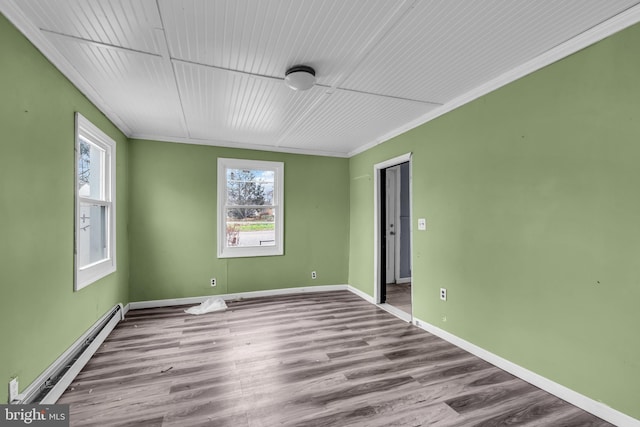 423 Main St, Dorchester, NJ 08316 - unfurnished room featuring wood finished floors, crown molding, baseboards, and baseboard heating