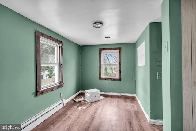 423 Main St, Dorchester, NJ 08316 - spare room with a baseboard radiator, wood finished floors, and baseboards