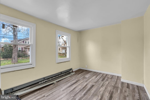 423 Main St, Dorchester, NJ 08316 - empty room featuring baseboards, wood finished floors, and baseboard heating