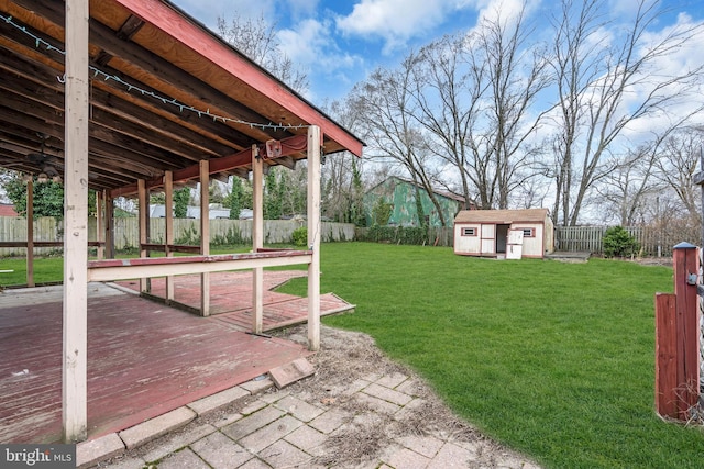 423 Main St, Dorchester, NJ 08316 - view of yard with an outdoor structure, a fenced backyard, a shed, and a wooden deck