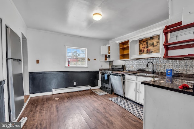 423 Main St, Dorchester, NJ 08316 - kitchen with a sink, open shelves, appliances with stainless steel finishes, white cabinets, and a baseboard heating unit