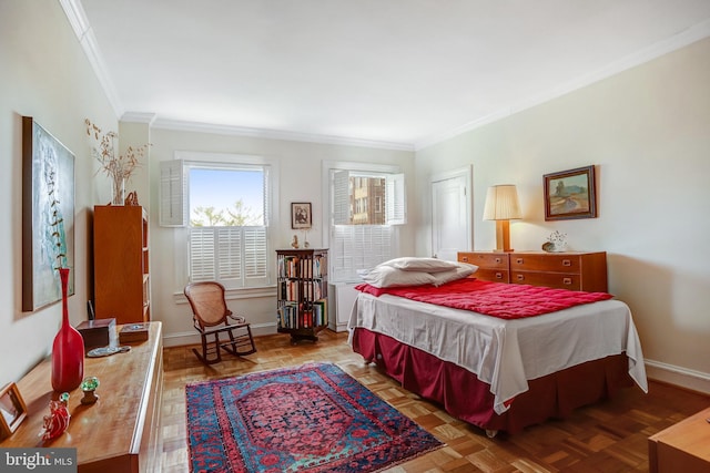 bedroom featuring baseboards and ornamental molding