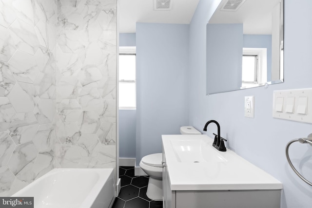bathroom with baseboards, visible vents, toilet, and vanity