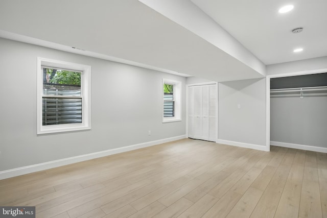 7434 Mason Ln, Falls Church, VA 22042 - unfurnished bedroom with baseboards, multiple windows, light wood-style floors, and recessed lighting