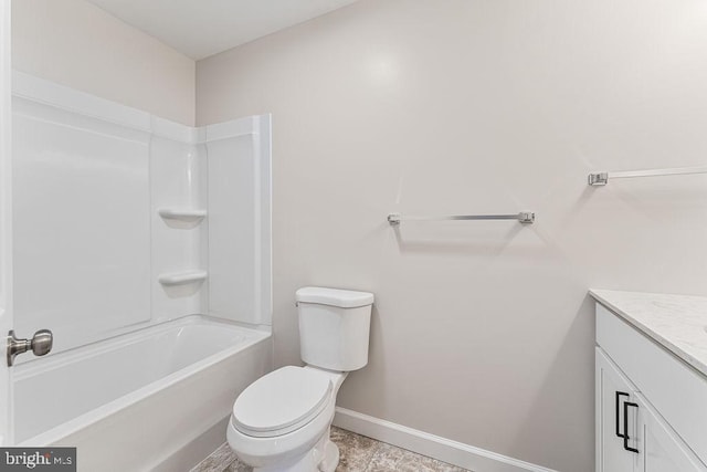 bathroom with baseboards, toilet, bathtub / shower combination, and vanity