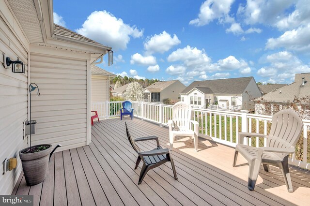 wooden deck with a residential view