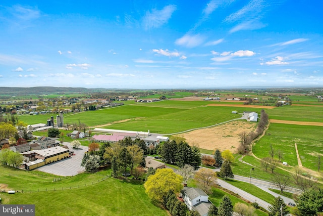 birds eye view of property with a rural view