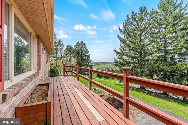 deck featuring a lawn