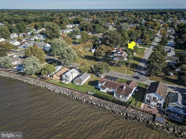 birds eye view of property featuring a water view and a residential view