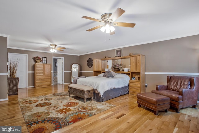 bedroom featuring crown molding, baseboards, wood finished floors, and a ceiling fan