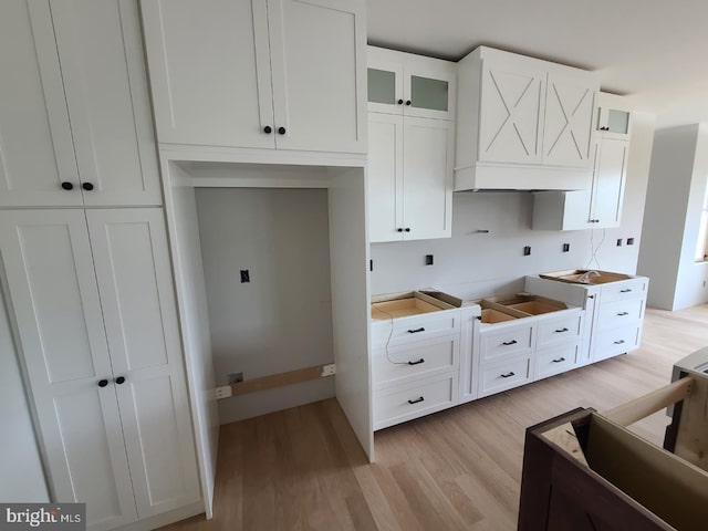 124 Primrose Ct, State College, PA 16801 - kitchen with white cabinets, glass insert cabinets, and light wood-style floors