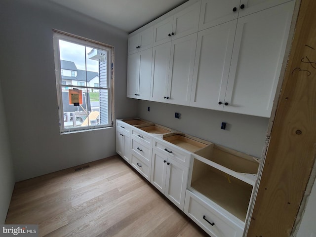 124 Primrose Ct, State College, PA 16801 - clothes washing area featuring visible vents and light wood finished floors