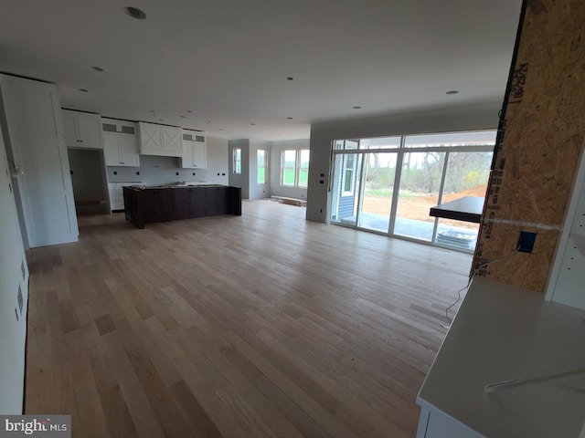 124 Primrose Ct, State College, PA 16801 - kitchen featuring open floor plan, white cabinetry, and light wood finished floors