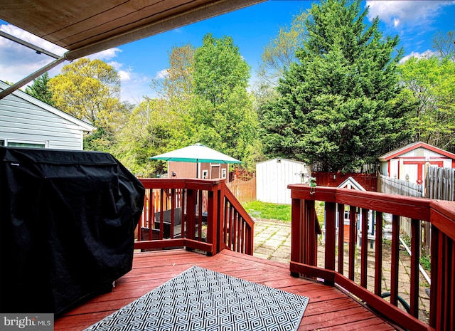 518 Macintosh Cir, Joppa, MD 21085 - wooden terrace with area for grilling, an outbuilding, a shed, and a fenced backyard
