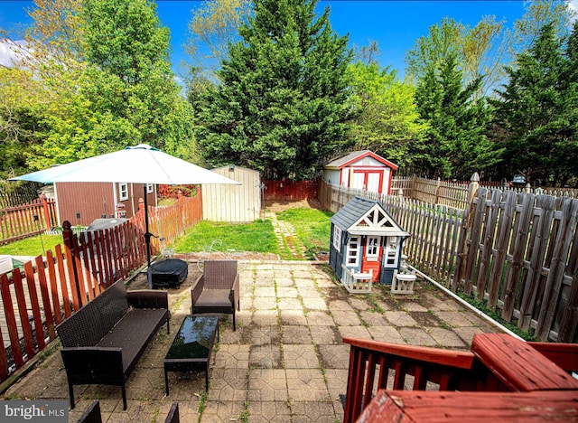 518 Macintosh Cir, Joppa, MD 21085 - view of patio with an outdoor structure, a shed, and a fenced backyard