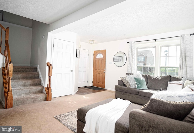 518 Macintosh Cir, Joppa, MD 21085 - living room featuring stairway, baseboards, carpet flooring, and a textured ceiling