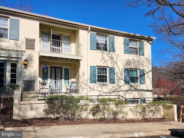 5900 Queenston St Unit 498, Springfield, VA 22152 - view of front of home featuring french doors, a balcony, and stucco siding