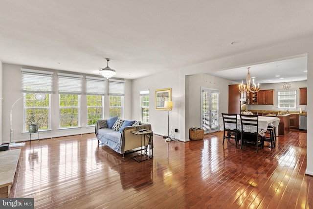 2710 Beech Orchard Ln, Upper Marlboro, MD 20774 - living area featuring an inviting chandelier and dark wood finished floors