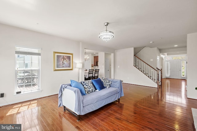 2710 Beech Orchard Ln, Upper Marlboro, MD 20774 - living room with stairway, hardwood / wood-style flooring, and an inviting chandelier