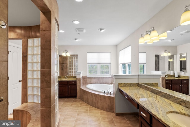 2710 Beech Orchard Ln, Upper Marlboro, MD 20774 - bathroom with a garden tub, two vanities, tile patterned floors, and a sink
