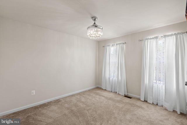 2710 Beech Orchard Ln, Upper Marlboro, MD 20774 - spare room with visible vents, baseboards, carpet, and a notable chandelier