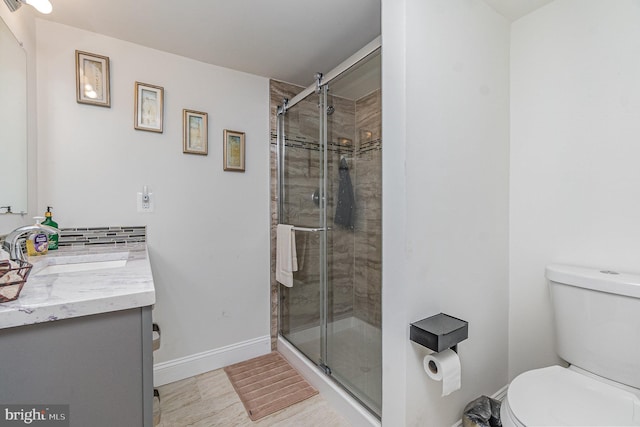 2220 Timothy Dr, Westminster, MD 21157 - bathroom featuring a shower stall, baseboards, toilet, and vanity