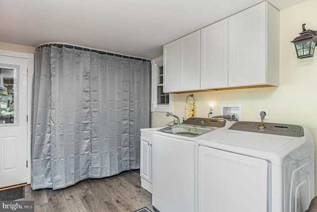 2220 Timothy Dr, Westminster, MD 21157 - clothes washing area featuring washer and clothes dryer, cabinet space, and light wood-style floors