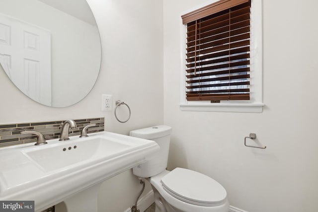 2220 Timothy Dr, Westminster, MD 21157 - bathroom featuring baseboards, tasteful backsplash, toilet, and a sink