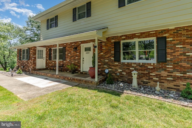 2220 Timothy Dr, Westminster, MD 21157 - view of front of house with brick siding, a porch, and a front yard