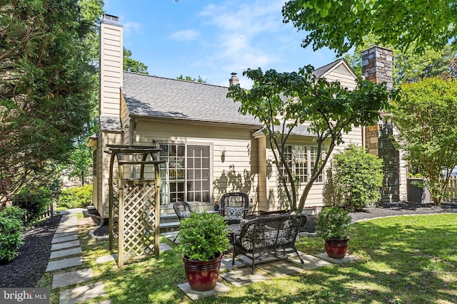 76 Deepdale Rd, Wayne, PA 19087 - back of house with a chimney, a yard, a patio area, a shingled roof, and outdoor lounge area
