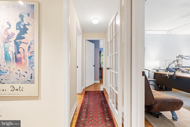 76 Deepdale Rd, Wayne, PA 19087 - hallway featuring an office area and wood finished floors