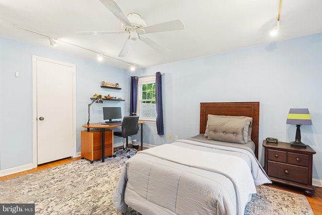 76 Deepdale Rd, Wayne, PA 19087 - bedroom with rail lighting, wood finished floors, an office area, and a ceiling fan