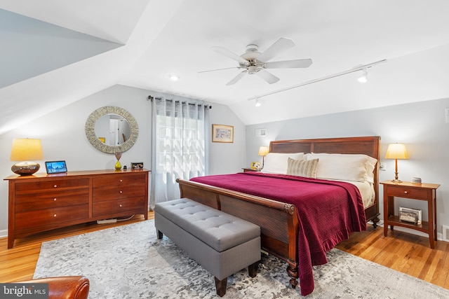 76 Deepdale Rd, Wayne, PA 19087 - bedroom featuring wood finished floors, rail lighting, vaulted ceiling, and a ceiling fan