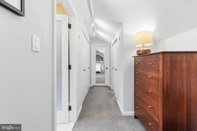 76 Deepdale Rd, Wayne, PA 19087 - hallway featuring light carpet, vaulted ceiling, and rail lighting