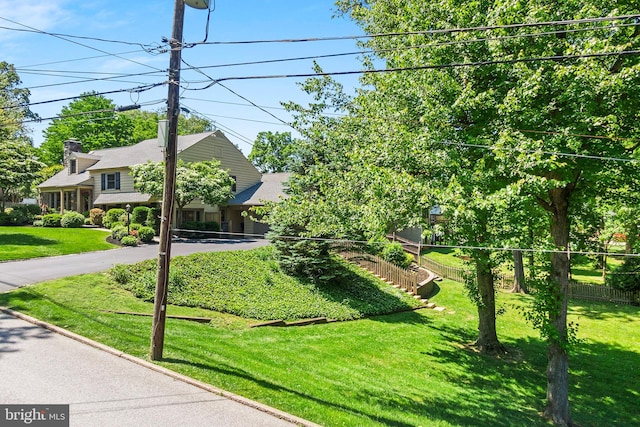 76 Deepdale Rd, Wayne, PA 19087 - view of front facade with driveway and a chimney