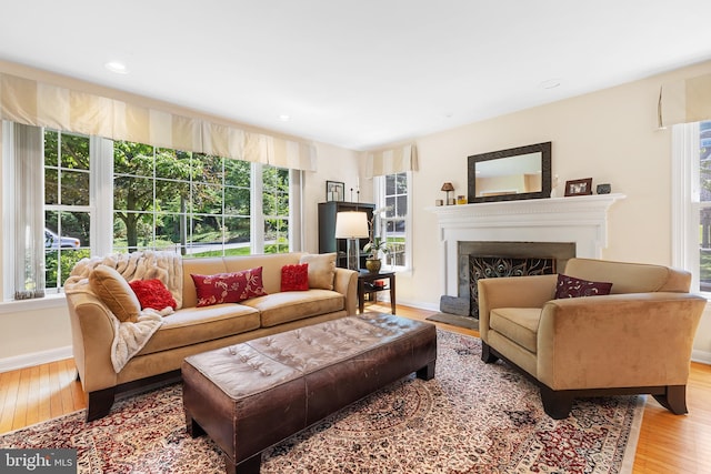 76 Deepdale Rd, Wayne, PA 19087 - living area with healthy amount of natural light, light wood-style floors, a fireplace with raised hearth, and recessed lighting