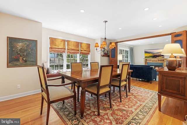 76 Deepdale Rd, Wayne, PA 19087 - dining area with recessed lighting, light wood-style floors, a chandelier, and a lit fireplace