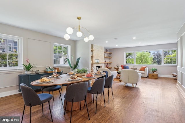 dining area with recessed lighting, wood finished floors, and a wealth of natural light