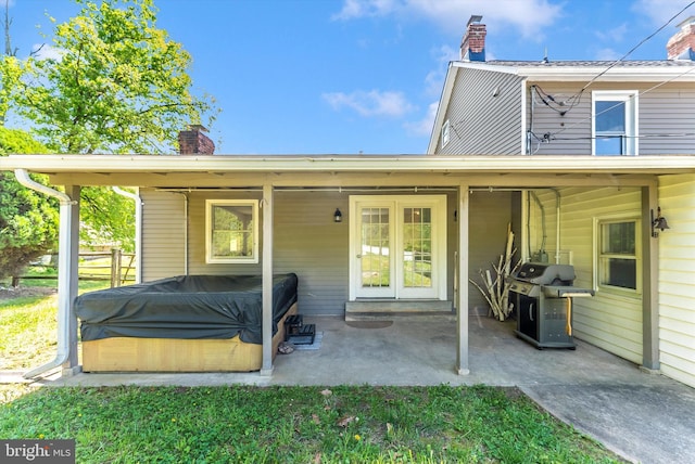 5431 Hines Rd, Frederick, MD 21704 - rear view of property featuring a hot tub, a patio, and a chimney