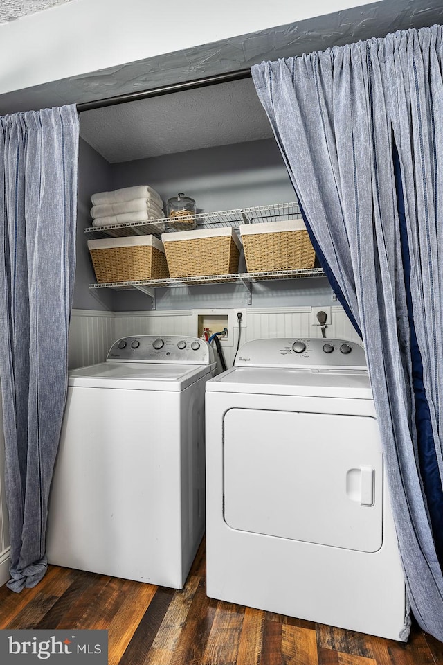washroom with washing machine and clothes dryer and dark wood-style floors