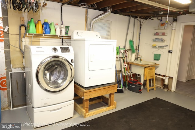 washroom featuring washer and dryer
