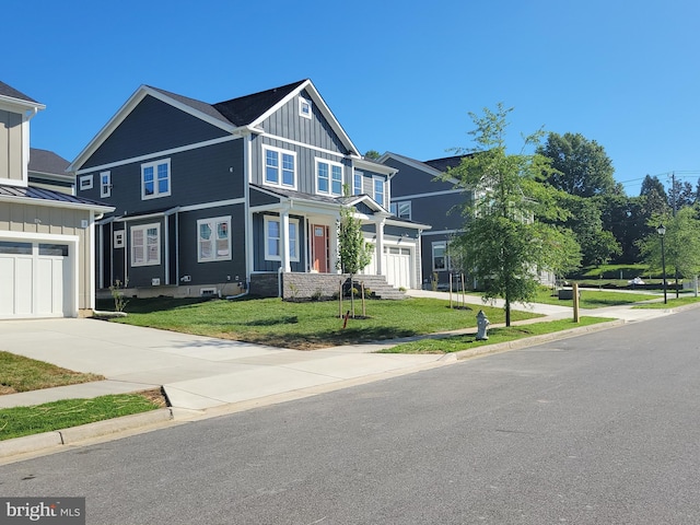 5807 Beecher St, Cheverly, MD 20785 - view of front of house featuring board and batten siding, a front yard, concrete driveway, a garage, and a standing seam roof