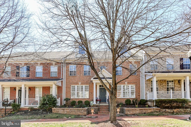 13824 Custis Sq, Woodbridge, VA 22191 - view of property with a porch and brick siding