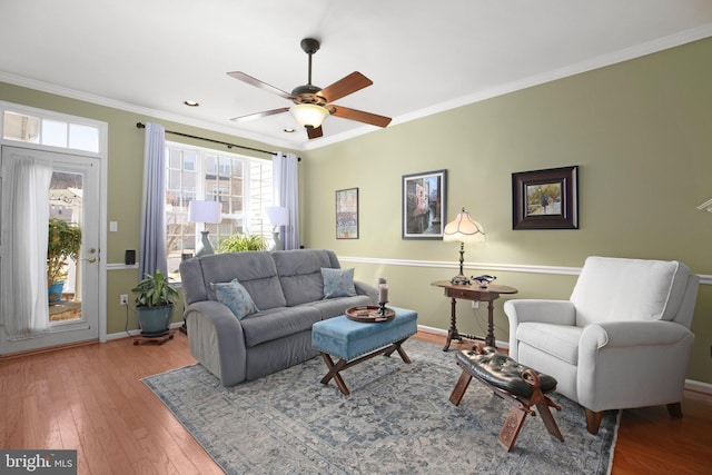 13824 Custis Sq, Woodbridge, VA 22191 - living room with baseboards, ornamental molding, hardwood / wood-style flooring, and a ceiling fan