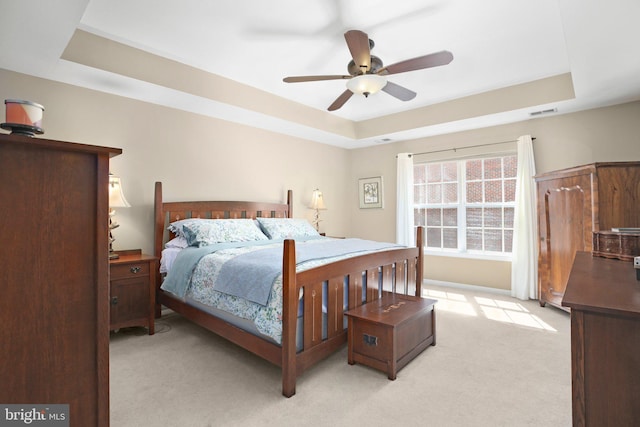 13824 Custis Sq, Woodbridge, VA 22191 - bedroom featuring ceiling fan, visible vents, light carpet, and a raised ceiling
