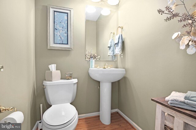 13824 Custis Sq, Woodbridge, VA 22191 - bathroom with baseboards, wood finished floors, toilet, and a sink