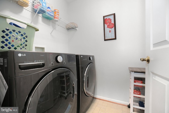 13824 Custis Sq, Woodbridge, VA 22191 - laundry area featuring baseboards, washer and dryer, and laundry area